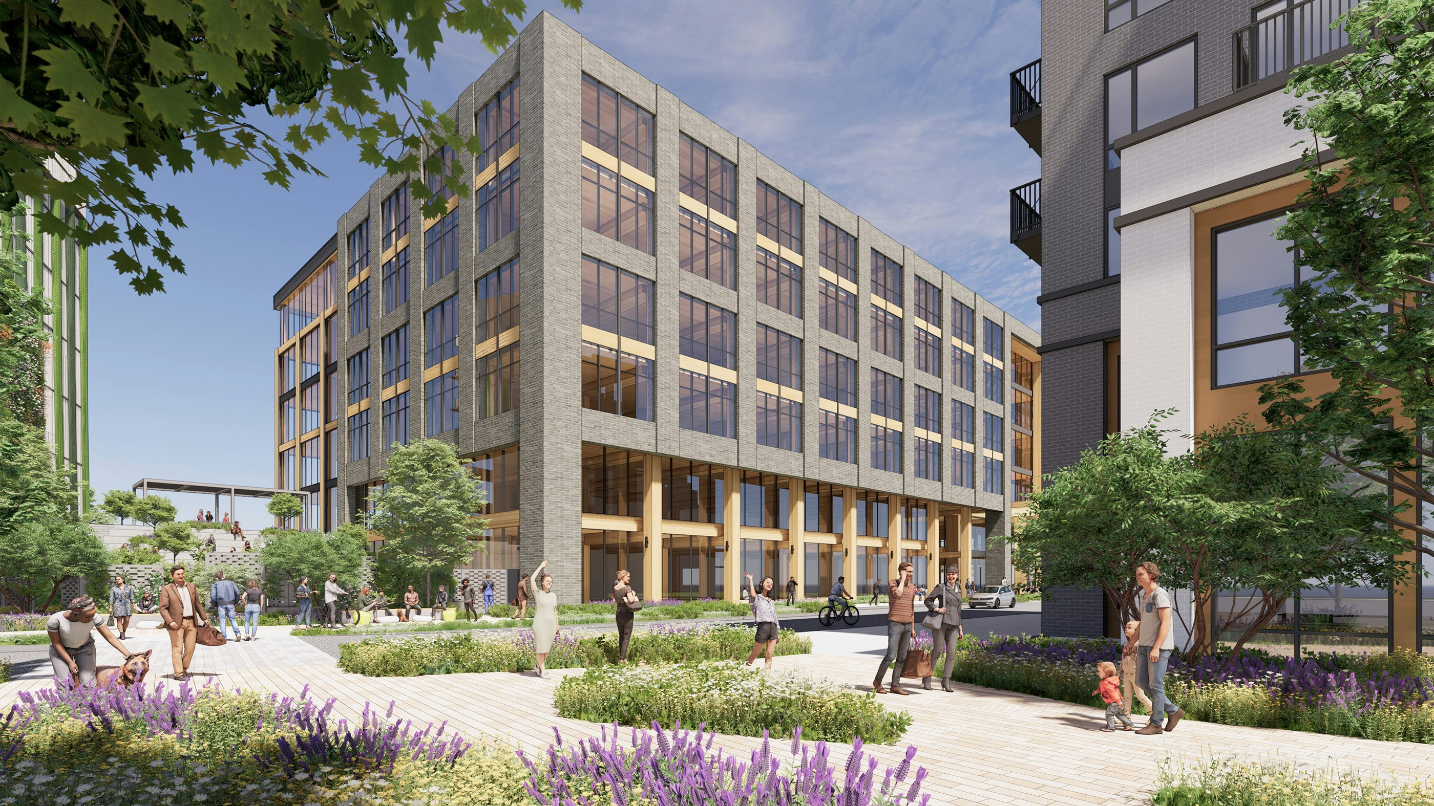 A grand plaza connects the new office and parking structure with the rest of the development.