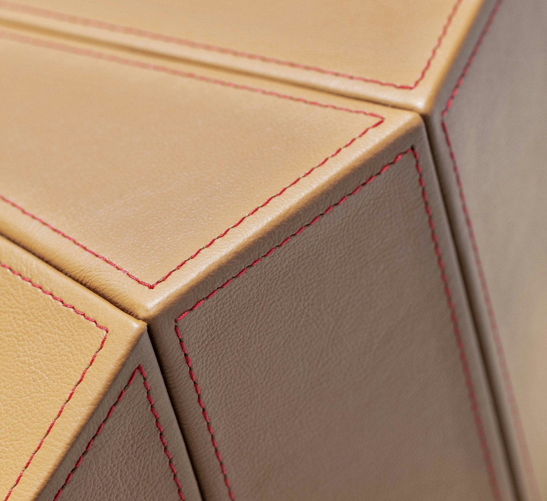 Reception desk leather details reminiscent of a baseball's stitching