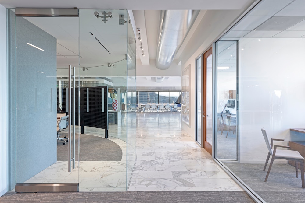 Circular meeting room and glass-fronted offices. 