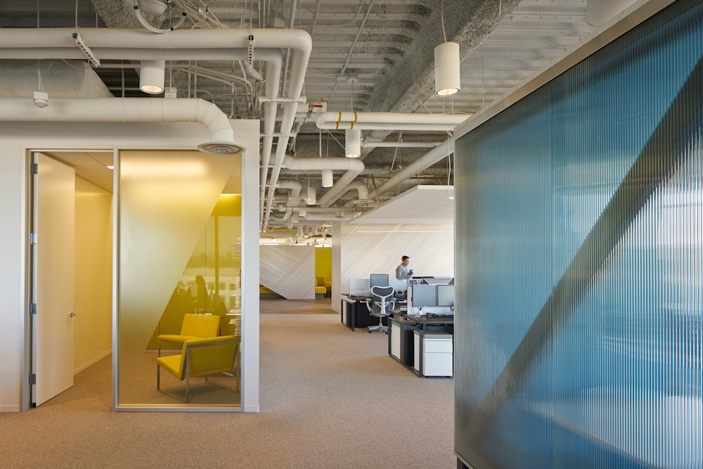 Fluted glass wall and open work area