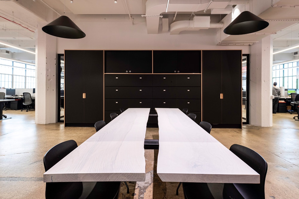 Open conference space and storage wall