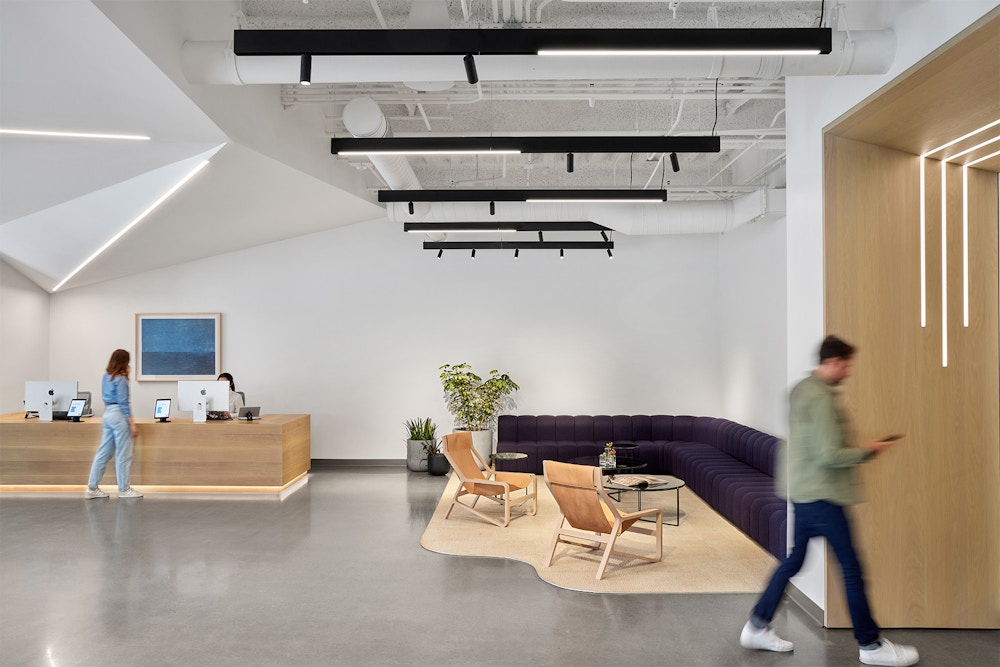 Visitors are welcomed by a well-appointed lounge space at the lobby.