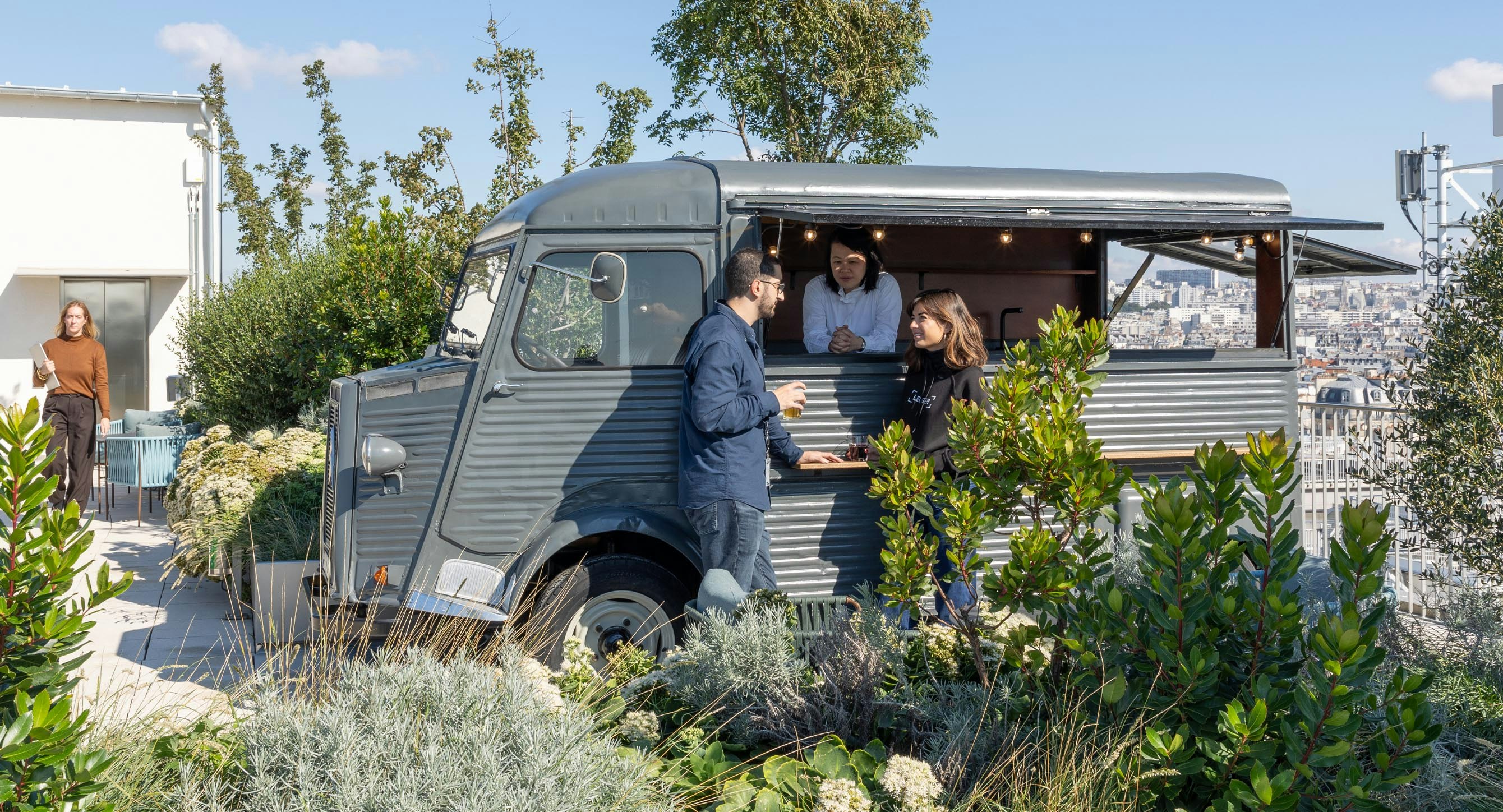 Retro Citroen van turned bar on the rooftop